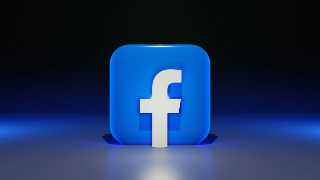 3D-weergave van het Facebook-logo in blauw op een donkere achtergrond
